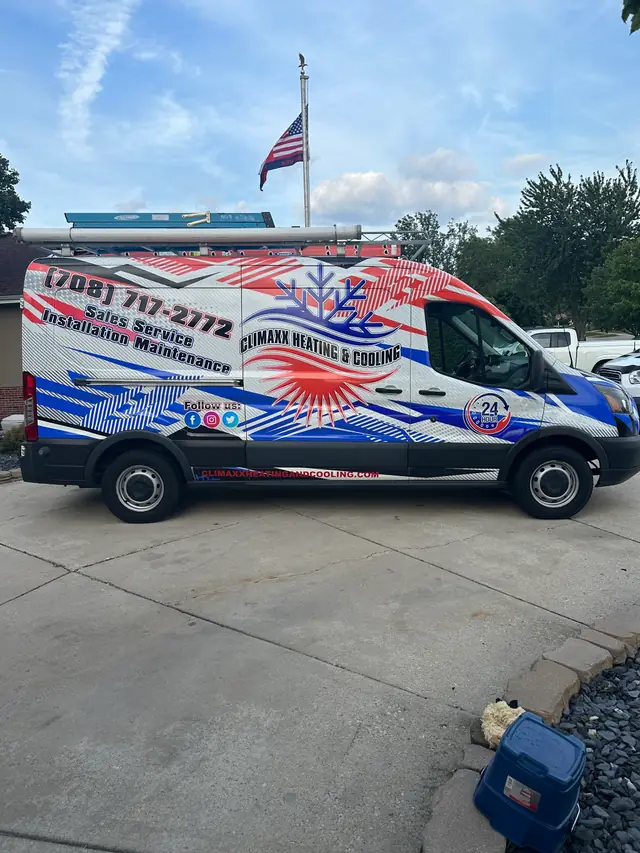 The Climaxx Heating & Cooling van: snowflake and sunburst livery, (708) 717-2772 and the 24-hour badge on the side